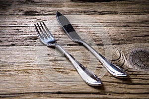Fish cutlery on wooden table