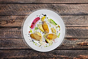 Fish cutlets stuffed with quail eggs with mashed potatoes.