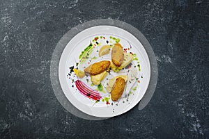 Fish cutlets stuffed with quail eggs with mashed potatoes.