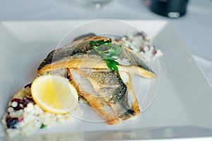 Fish dish - fish fillet and vegetables in restaurante photo