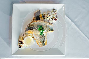 Fish dish - fish fillet and vegetables in restaurante photo