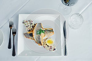 Fish dish - fish fillet and vegetables in restaurante photo