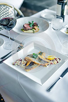 Fish dish - fish fillet and vegetables in restaurante photo