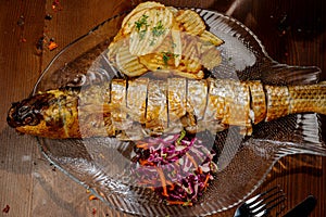 Fish dish - fried fish fillet with vegetables.Top view