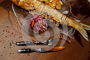 Fish dish - fried fish fillet with vegetables.Top view