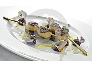 Fish Dish Skewer of Scallops Crusted with black Rice and Purple