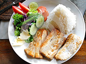 Fish dish with vegetable side salad