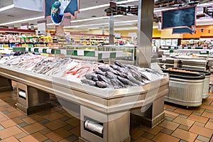 Fish displayed on ice at Supermarket seafood aisle