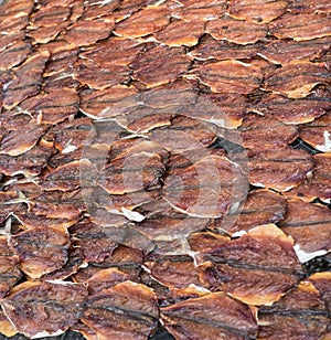 Fish drying in sun. Food background