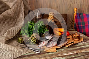 Fish european bass Dicentrarchus labrax on a wooden table