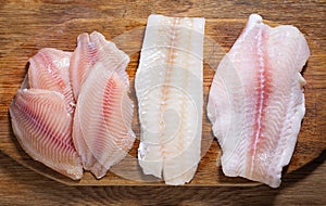 fish fillet of cod, tilapia and pangasius, top view