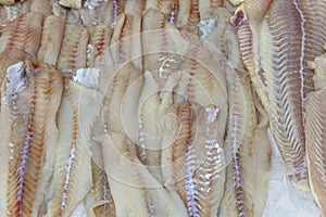 Fish fillet on ice on the counter. Healthy foods and diet. Close-up. Background