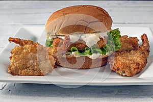 Fish fillet sandwich served  top with tarter sauce