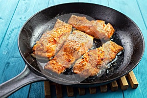 Fish fillets on skillet