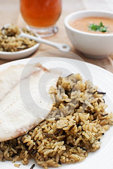 Fish fillets with wild brown rice