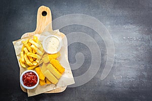 Fish finger and french fries or chips with tomato ketchup and mayonnaise sauce