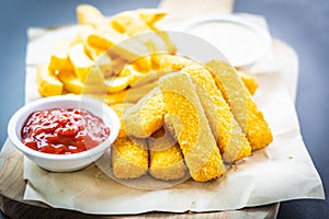 Fish finger and french fries or chips with tomato ketchup and mayonnaise sauce