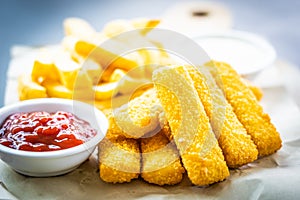 Fish finger and french fries or chips with tomato ketchup and mayonnaise sauce