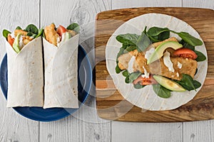 Fish finger wraps with avocado and tomato