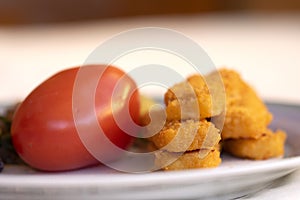 fish fingers and fresh tomato