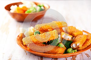 Fish fingers with vegetables side dish
