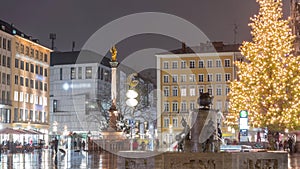Fish Fountain, Fischbrunnen in front of the New New Town Hall at Marienplatz night timelapse in Munich, Germany