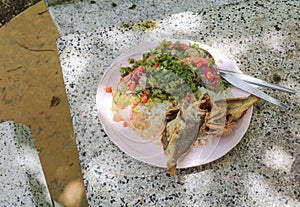 Fish fried and winged bean in rice plateThai food countryside