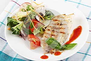Fish grill with salad