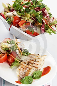 Fish grill with salad