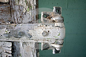 Old Door Hinge Inside a National Fish Hatchery Long Abandoned at Elephant Butte State Park built in 1937. photo