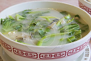 Fish Head Soup with Chinese Vegetable Closeup photo