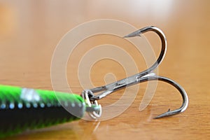 Fish hook on wooden background