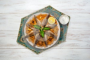 Fish Kabsa - mixed rice dishes that originates in Yemen. Middle eastern food.