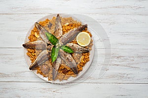 Fish Kabsa - mixed rice dishes that originates in Yemen. Middle eastern food.