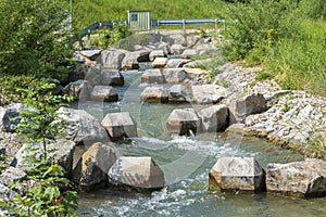 Fish ladder for migration of spawning fish in river stream