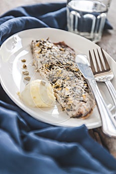 Fish mackerel baked with herbs, mashed potatoes, pesto sauce ser