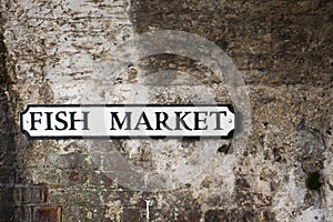 Fish market sign on brickwork bridge