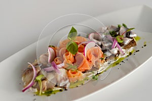 Fish mix with vegetables. Cold appetizer