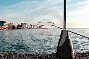 Fish net on the background of the beautiful sandy beach of Katerini Paralia, Pieria, Greece