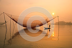 Fish net on Hoai river in ancient Hoian town in Vietnam.