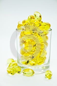 Fish oil capsule in the cup.