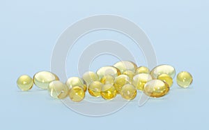 Fish oil capsules  on a blue  background