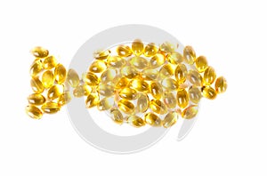 Fish oil capsules Omega 3 isolated on white background and many other of capsules on blurred background. Close up, high resolution