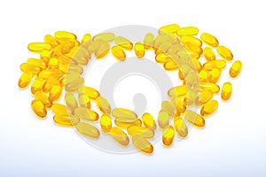 Fish oil capsules yellow heart shaped