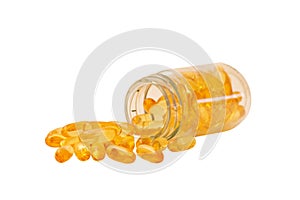 Fish oil, omega 3 and vitamin D capsules in glass bottle on a white background