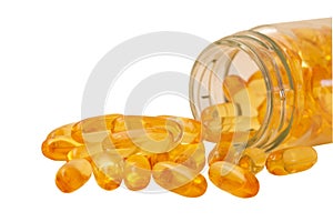 Fish oil, omega 3 and vitamin D capsules in glass bottle on a white background