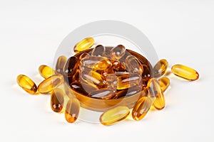 Fish oil omega 3 gel capsules on a light background.