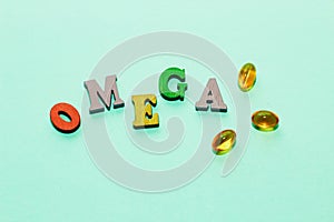 Fish oil pills in a golden jelly shell with the letters Omega on a green background.