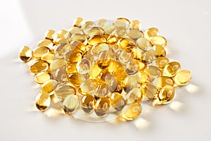 Fish oil pills over white background