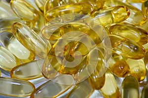 Fish oil suplements. Omega 3 suplement capsules close up photography